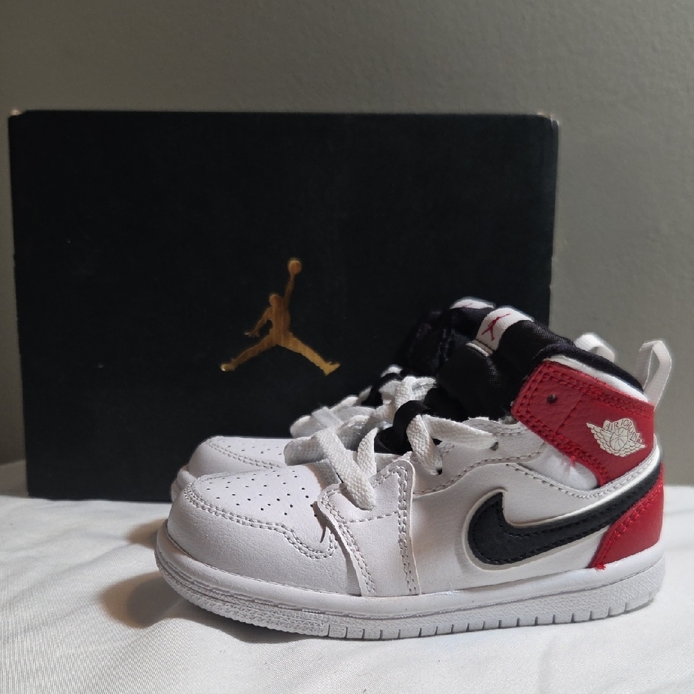 Nike Kids White, Black, and Red Sneakers. Jordan 1 MID Size 7c.
